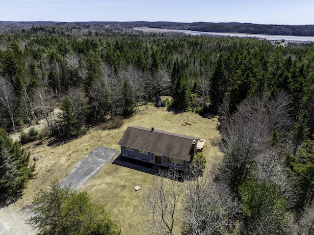 drone / aerial view featuring a view of trees