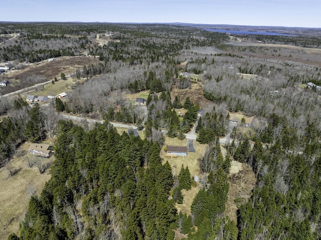 birds eye view of property featuring a view of trees
