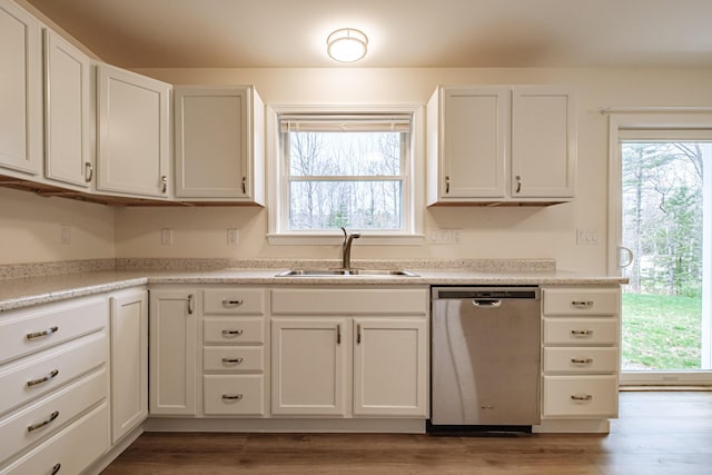 26 Townsend Ln, Boothbay, ME 04537 - kitchen featuring stainless steel dishwasher, white cabinetry, a sink, and light wood-style flooring