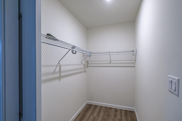 26 Townsend Ln, Boothbay, ME 04537 - walk in closet featuring wood finished floors