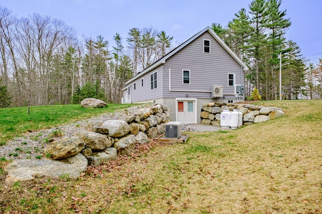 26 Townsend Ln, Boothbay, ME 04537 - back of house featuring a lawn and ac unit