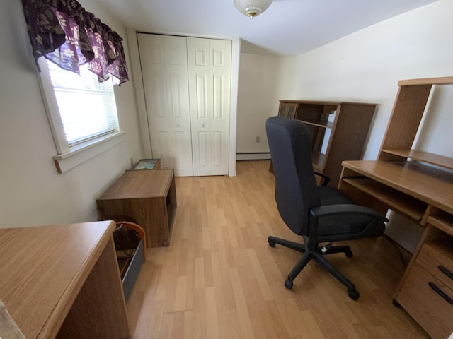 office with a baseboard radiator and light hardwood / wood-style flooring