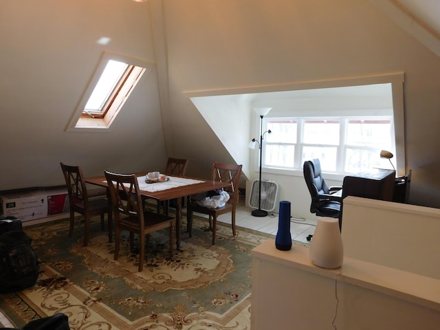 office featuring lofted ceiling with skylight