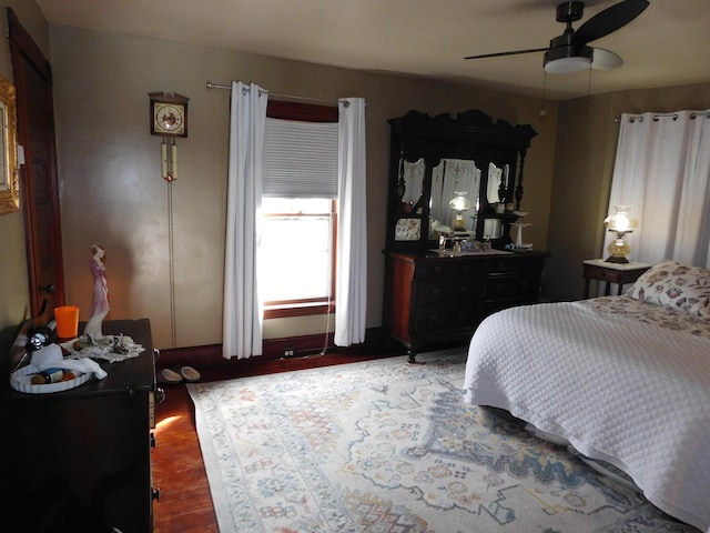 bedroom featuring dark wood-type flooring and ceiling fan