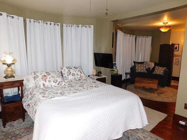 bedroom featuring wood-type flooring