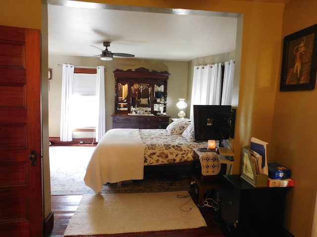 bedroom featuring hardwood / wood-style flooring and ceiling fan