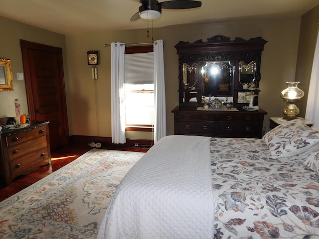 bedroom with hardwood / wood-style floors and ceiling fan