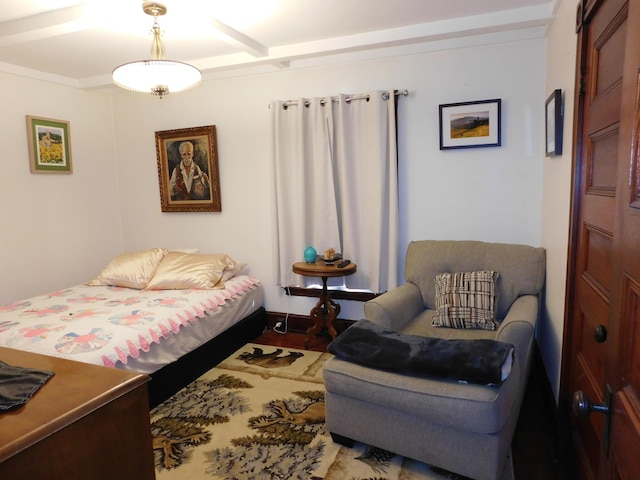 bedroom with beamed ceiling and wood-type flooring