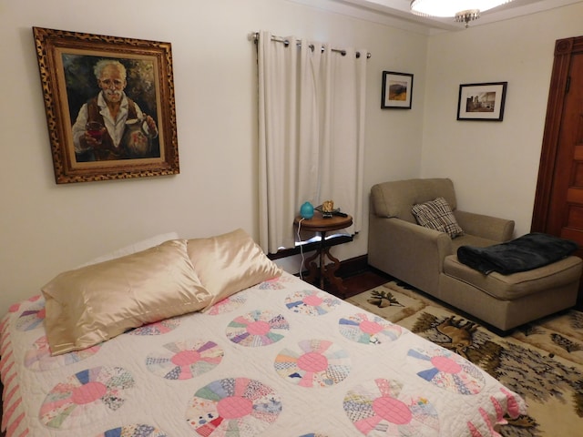 bedroom featuring wood-type flooring