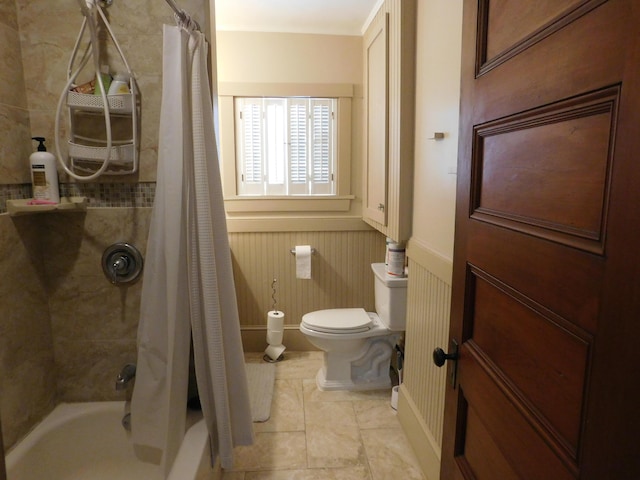 bathroom with shower / tub combo with curtain, toilet, and tile patterned flooring