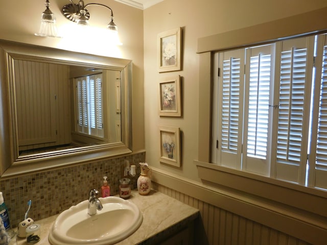 bathroom featuring tasteful backsplash and vanity