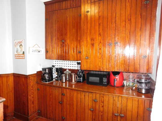 kitchen featuring wooden walls