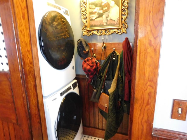 laundry area with stacked washer / dryer