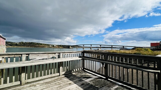 deck featuring a water view