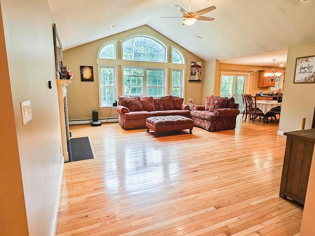 living room featuring a baseboard heating unit, light wood-style flooring, and high vaulted ceiling