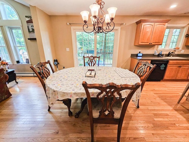 dining area with light wood finished floors and plenty of natural light