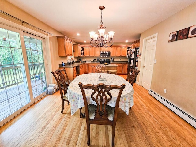 dining area with light wood-type flooring, recessed lighting, a baseboard radiator, and an inviting chandelier