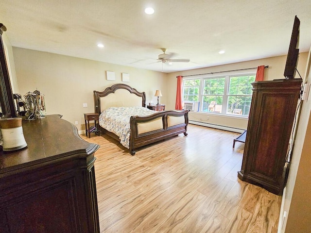 bedroom featuring ceiling fan, recessed lighting, baseboards, light wood-style floors, and baseboard heating