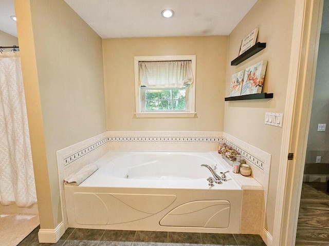 full bath with recessed lighting, a garden tub, and tile patterned floors