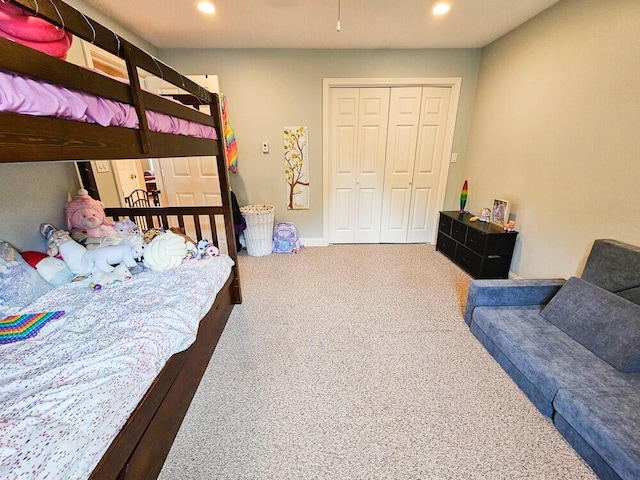 carpeted bedroom featuring recessed lighting, a closet, and baseboards