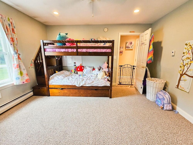 carpeted bedroom with recessed lighting, baseboards, and a baseboard radiator