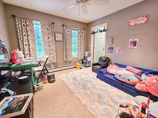 carpeted bedroom featuring ceiling fan and a baseboard heating unit