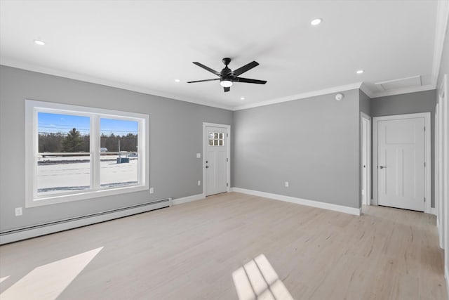 spare room featuring ceiling fan, ornamental molding, light wood-type flooring, and a baseboard heating unit