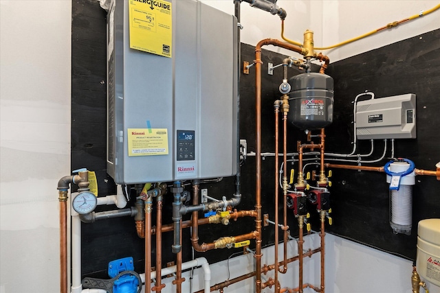 utility room with water heater