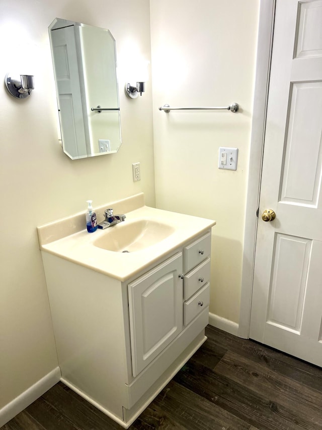 bathroom with vanity and hardwood / wood-style flooring