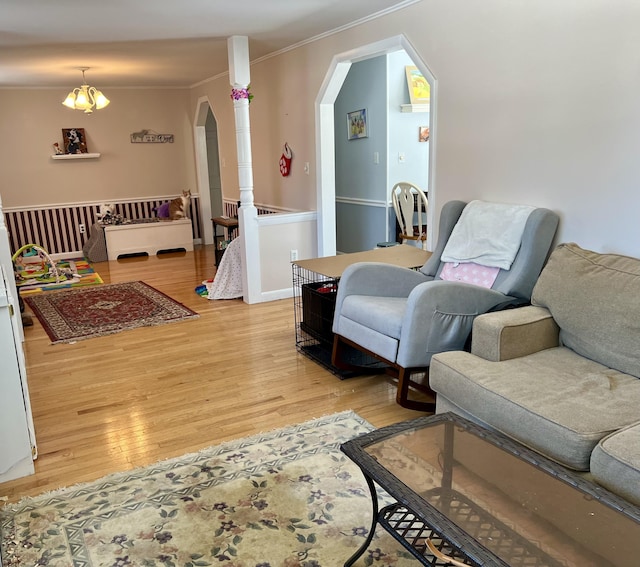 living room featuring crown molding and wood-type flooring