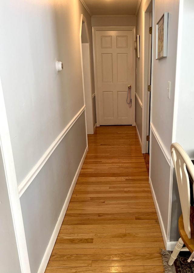 corridor with light hardwood / wood-style flooring