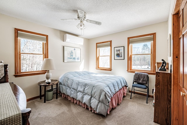 bedroom featuring baseboards, an AC wall unit, multiple windows, and light colored carpet