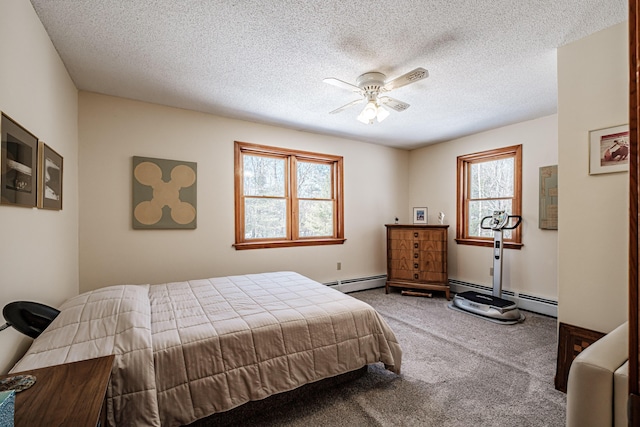 bedroom with a ceiling fan, carpet, a textured ceiling, and baseboard heating