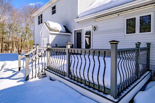 view of snow covered deck