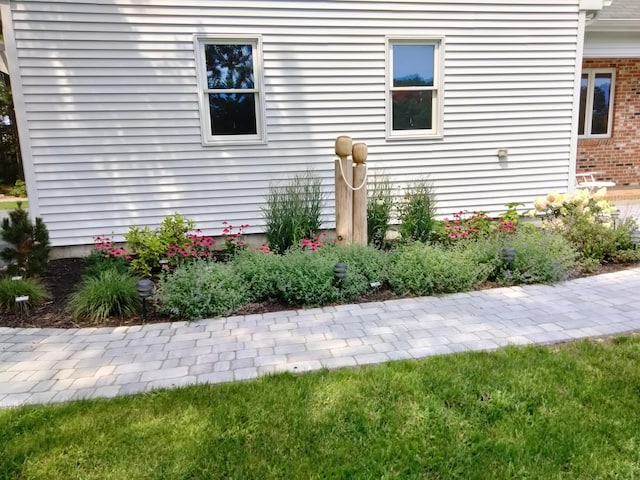 view of side of property with brick siding