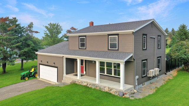 28 Grendell Rd, Mapleton, ME 04757 - view of front facade with a garage, covered porch, and a front lawn