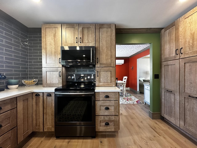 28 Grendell Rd, Mapleton, ME 04757 - kitchen with ornamental molding, light hardwood / wood-style floors, decorative backsplash, and range with electric stovetop