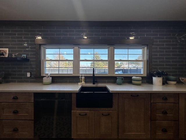 28 Grendell Rd, Mapleton, ME 04757 - kitchen featuring a healthy amount of sunlight, black dishwasher, sink, and decorative backsplash