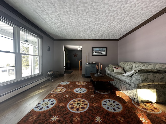 28 Grendell Rd, Mapleton, ME 04757 - living room with ornamental molding, hardwood / wood-style floors, and baseboard heating