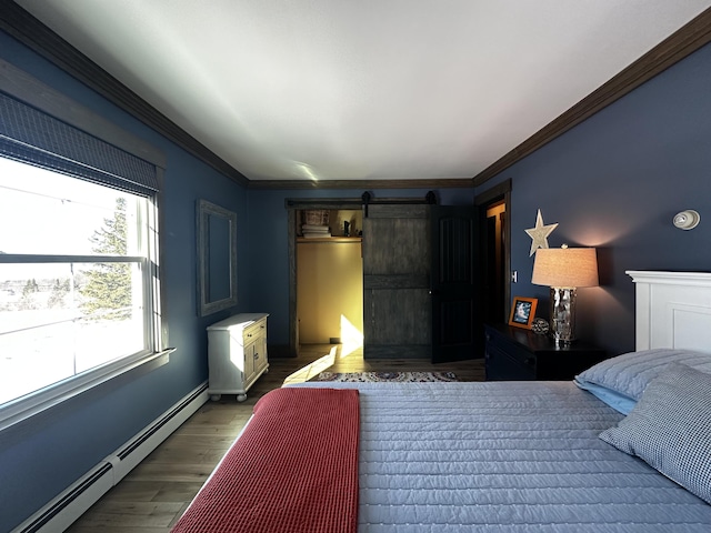 28 Grendell Rd, Mapleton, ME 04757 - bedroom featuring baseboard heating, a barn door, dark wood-type flooring, and crown molding