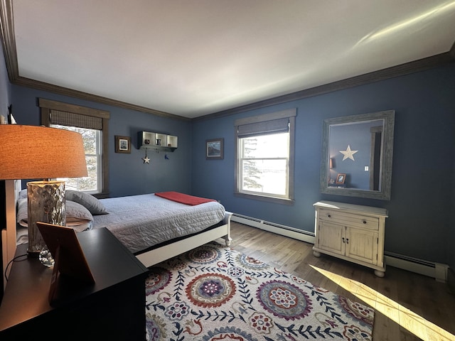 28 Grendell Rd, Mapleton, ME 04757 - bedroom with multiple windows, light hardwood / wood-style flooring, ornamental molding, and baseboard heating