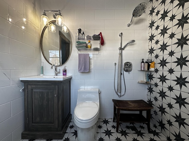 28 Grendell Rd, Mapleton, ME 04757 - bathroom featuring vanity, toilet, tile walls, and walk in shower