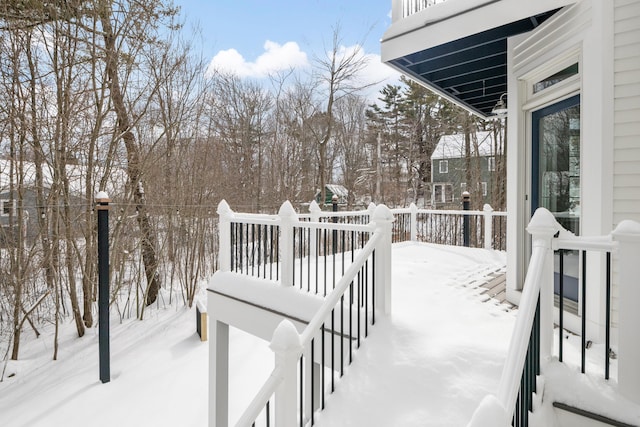 view of snow covered deck