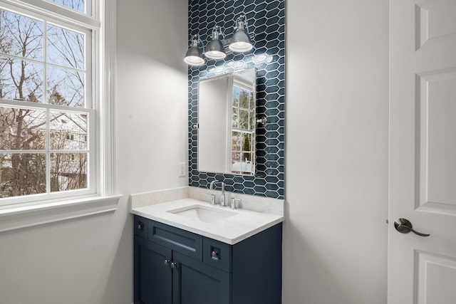 bathroom featuring a wealth of natural light and vanity