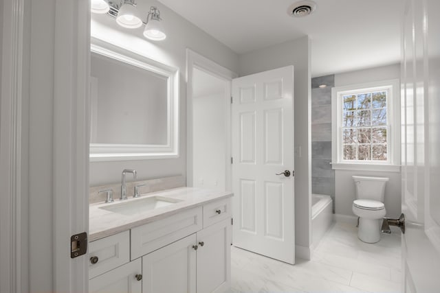 full bathroom featuring toilet, marble finish floor, vanity, and visible vents