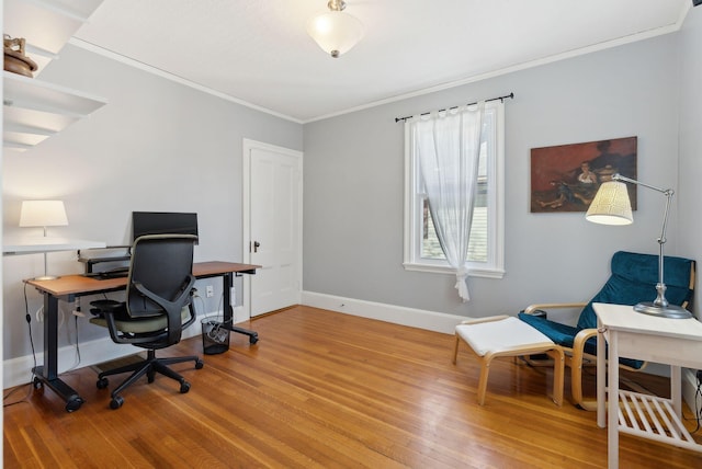 office featuring crown molding, baseboards, and wood finished floors