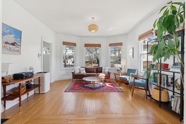 living area with parquet floors and baseboards