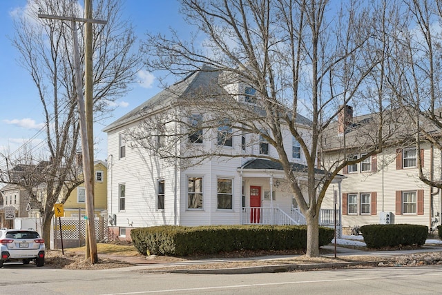 view of front facade featuring fence