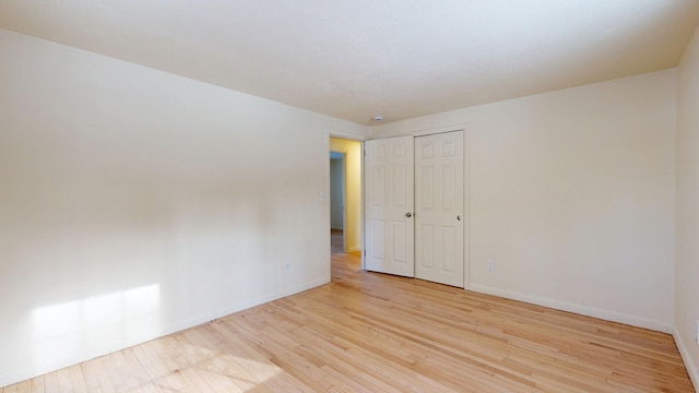 spare room featuring light hardwood / wood-style flooring