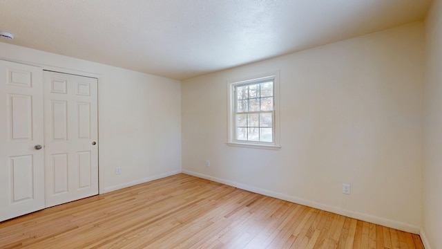 unfurnished bedroom with light hardwood / wood-style flooring